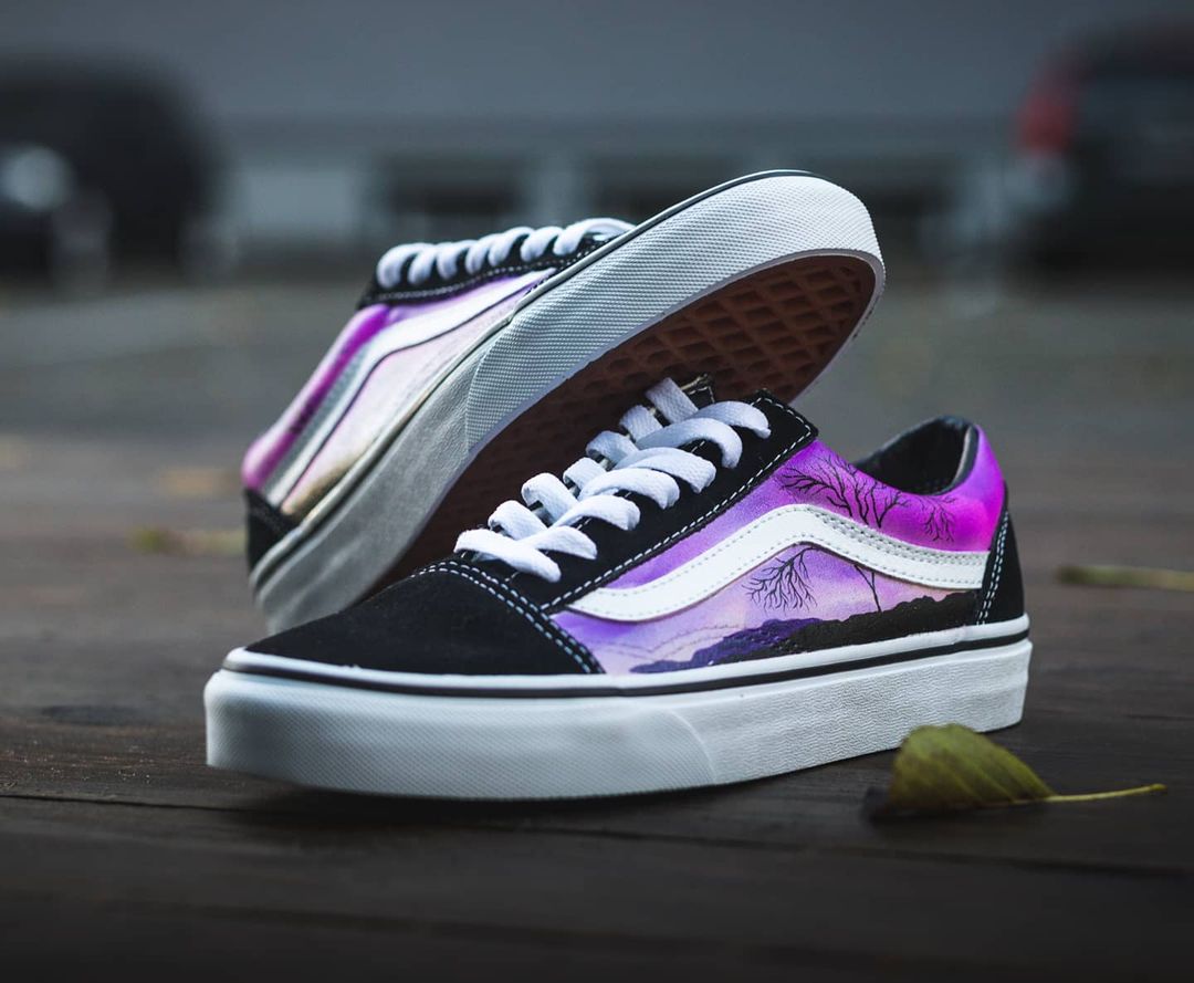 Custom vans old skool sneakers with a custom hand painteddesign. Sneakers are blck old skools on a street background