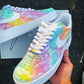 Close-up of custom Air Force 1 with handpainted pastel clouds and soft rainbow hues, showcasing the white swoosh and lace details.