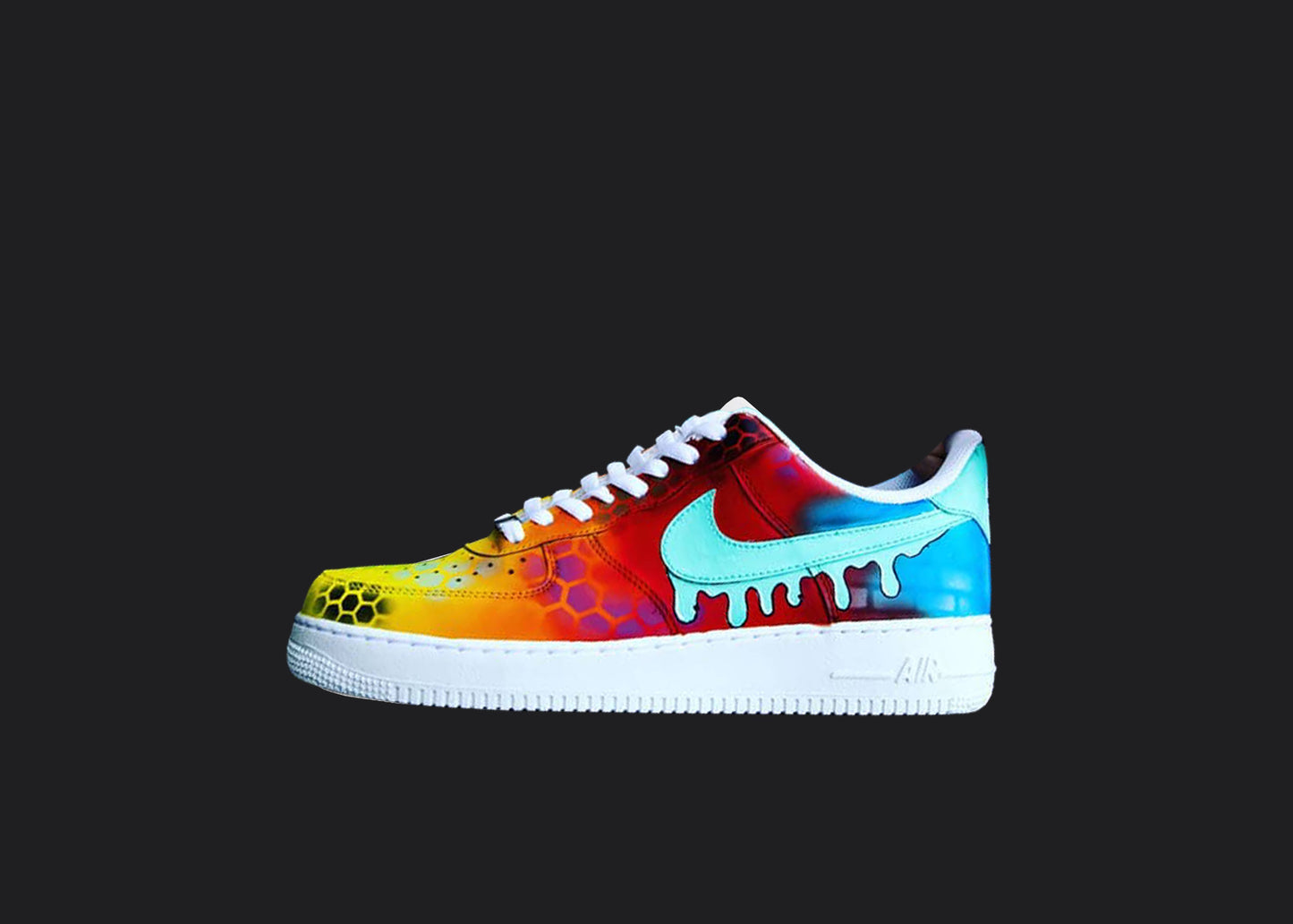 Custom Air Force 1 sneakers with a vibrant color fade from yellow to blue, featuring hexed patterns and a dripping blue Nike swoosh