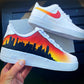 Nike Air Force 1 with a custom painted cityscape silhouette against a vibrant orange and yellow sunset gradient.