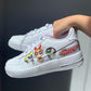 a pair of nike air force 1s with a powerpuff girls design on the outside sections of the sneakers. Blank gray shadow wall on the background