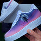 Close-up of a customized Nike Air Force 1 with a galactic sky in pink and purple hues, highlighted by a large moon and a silhouette of a person swinging. The Nike swoosh has a gradient design complementing the dreamy galaxy theme.