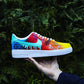 Artistic custom Air Force 1 sneakers with a seamless fade of yellow, orange, red, and blue, complemented by hexed patterns and a dripping swoosh.