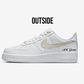 white nike air force 1 sideview of the outside sneaker, beige swoosh and text mr groom written in black on the heel of the shoe