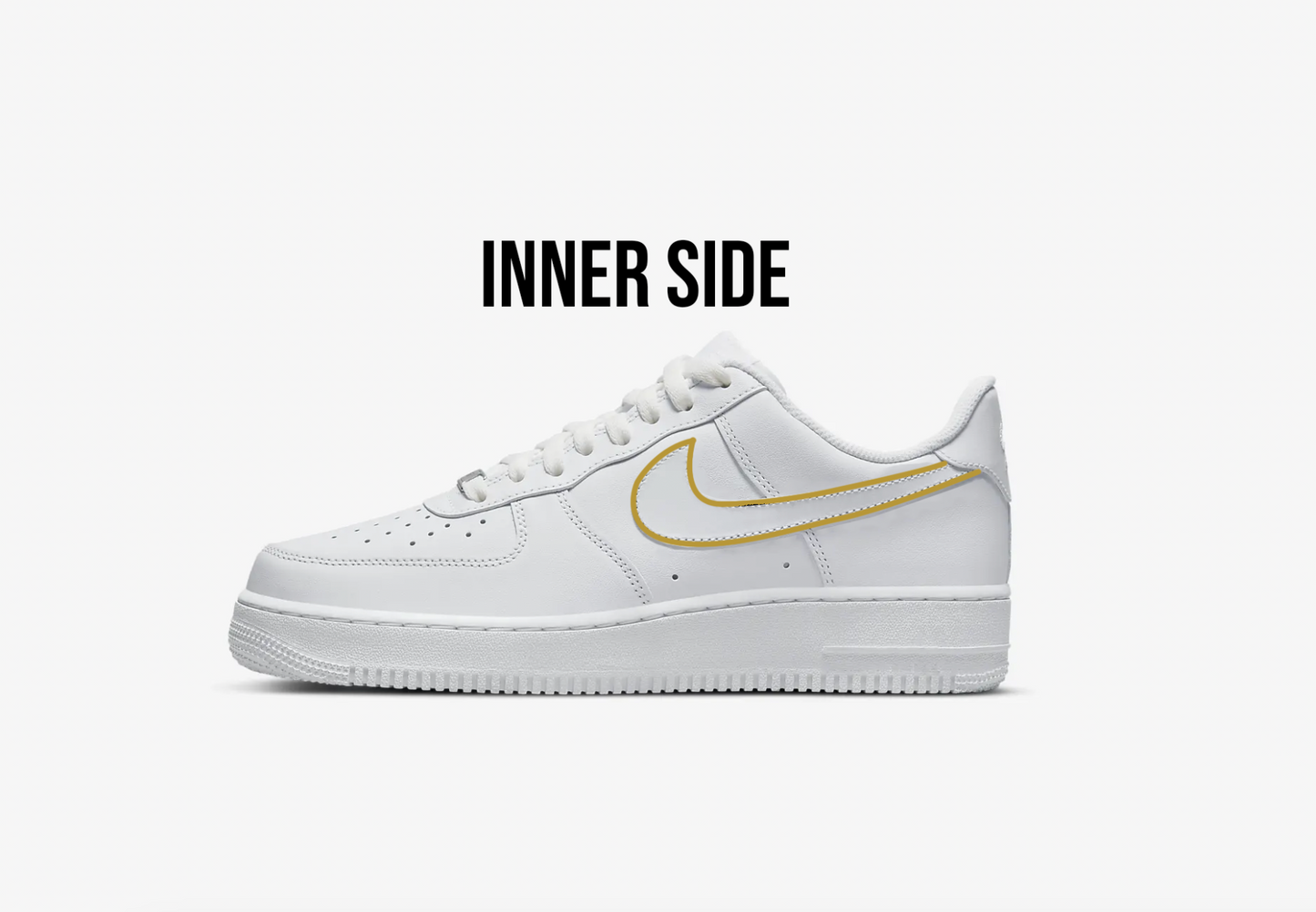 sideview of the inner side of nike air force 1 low white model, nike swoosh is custom handpainted with a gold outline