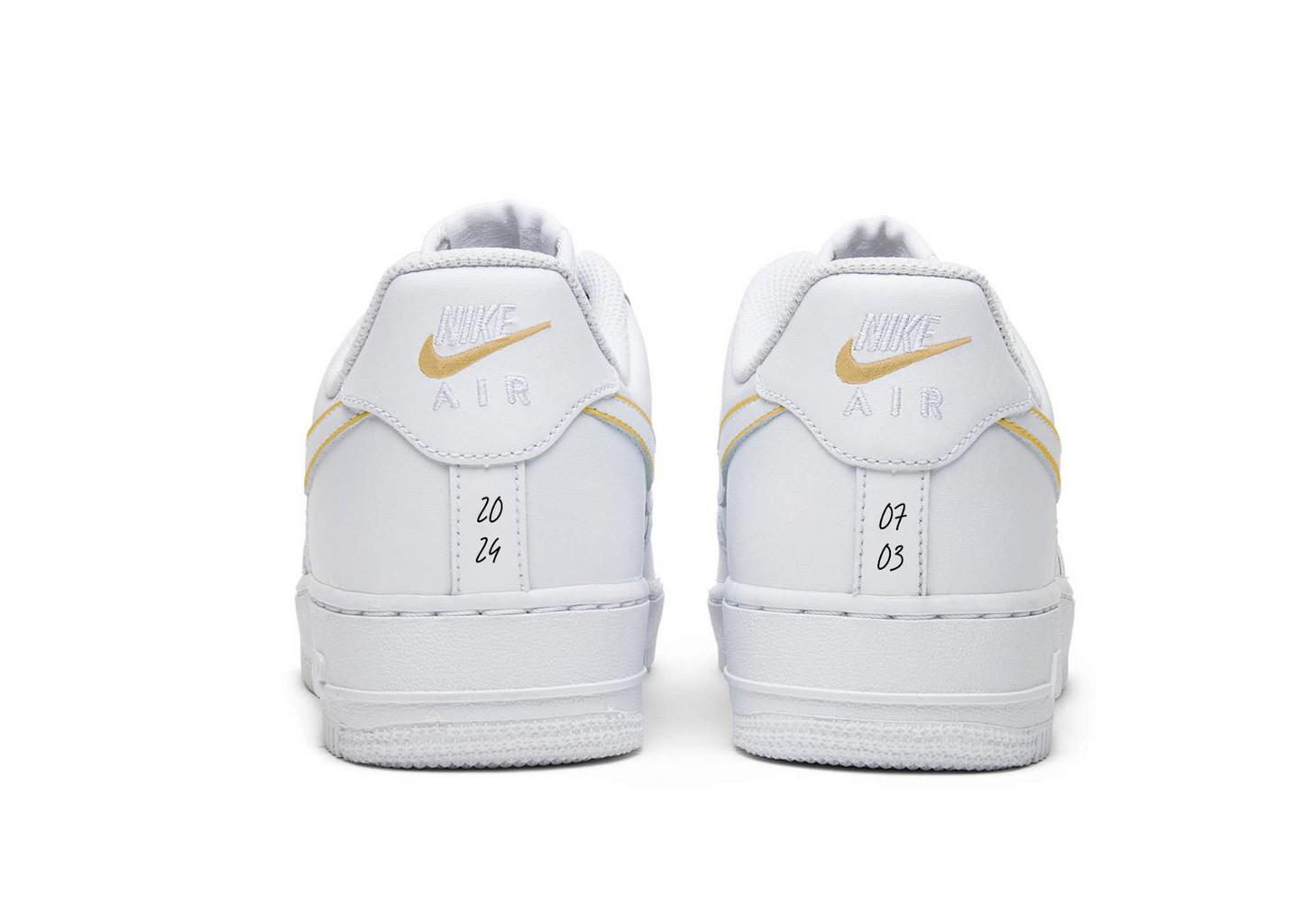 nike air force one from backside view with gold nike logo outlines and dates written in black on the back of the sneakers