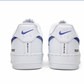 white nike air force 1 sneaker from back, blue nike swooshes, painted logo, and text in black on the heel of the sneakers