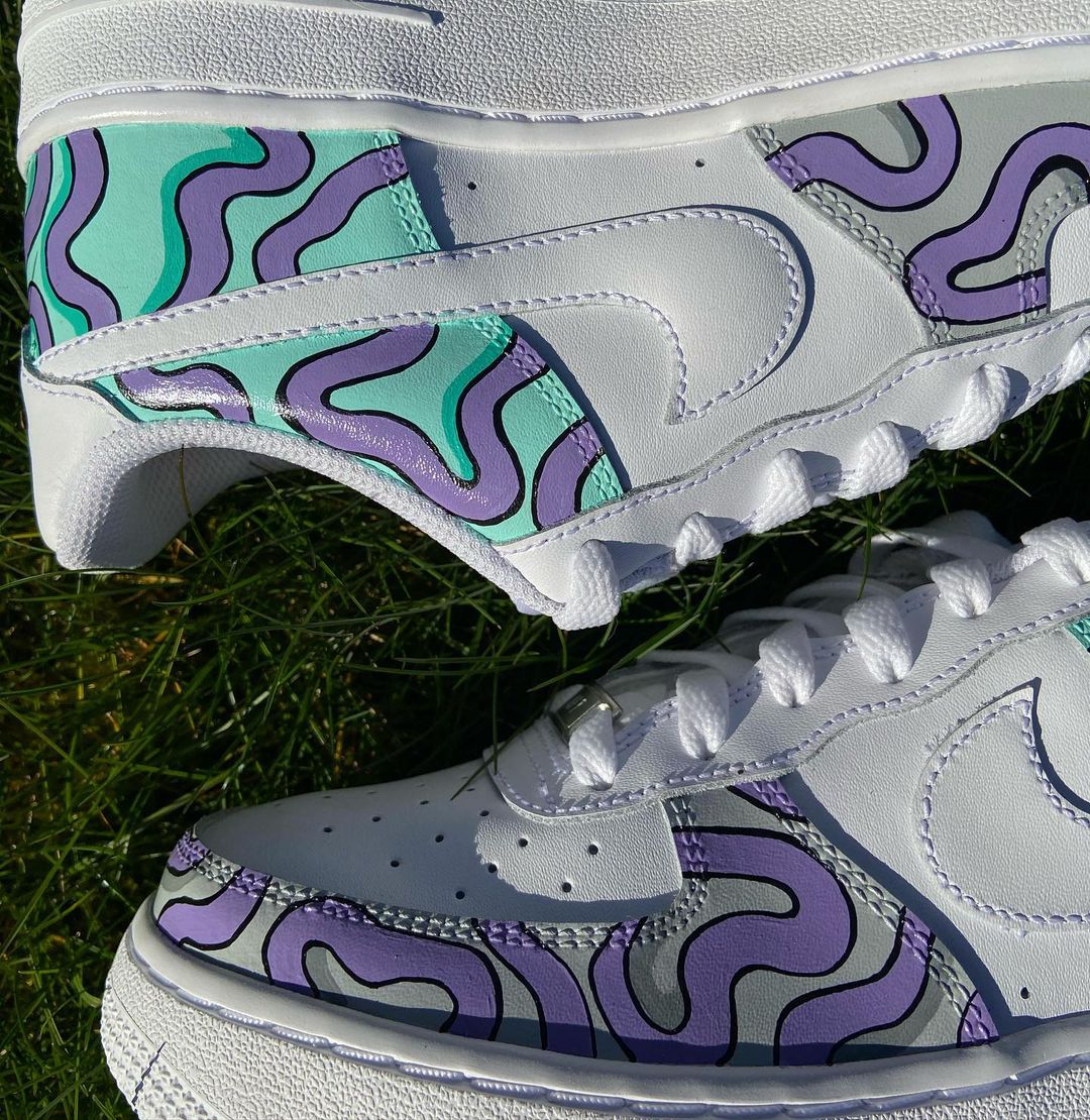 Nike Air Force 1s with a unique custom design in mint and lavender, showcasing flowing, hand-painted swirl patterns that bring a playful yet stylish aesthetic to these sneakers.