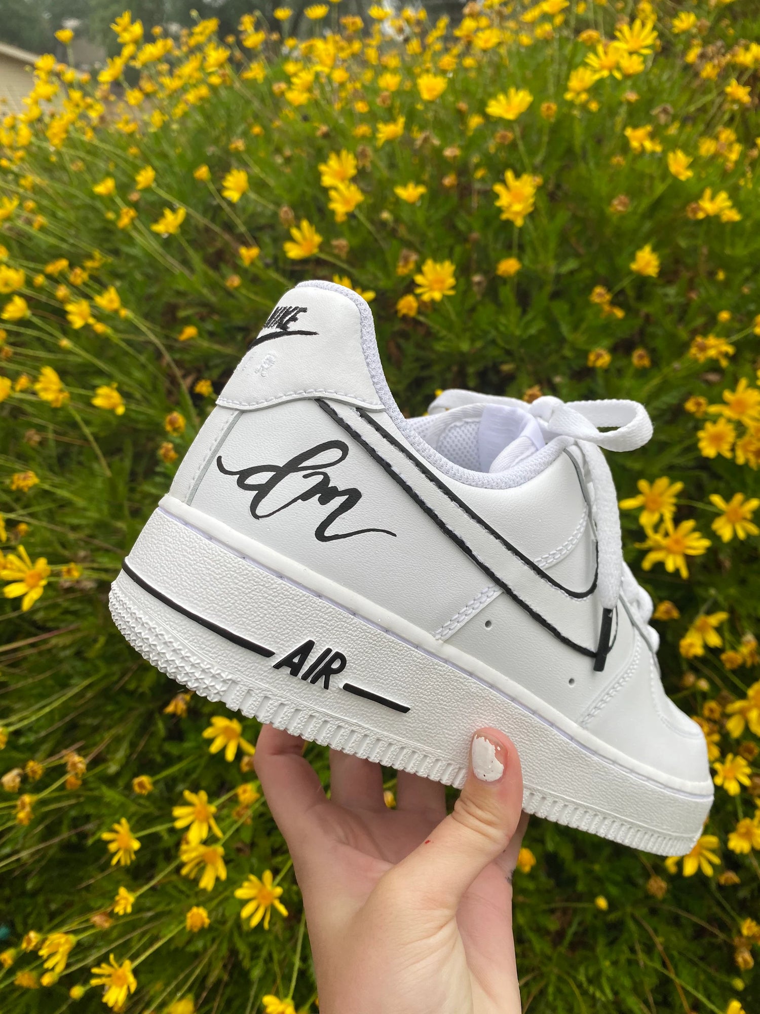 Custom hand painted nike air force 1 white sneakers with a minimalist black design of initials
