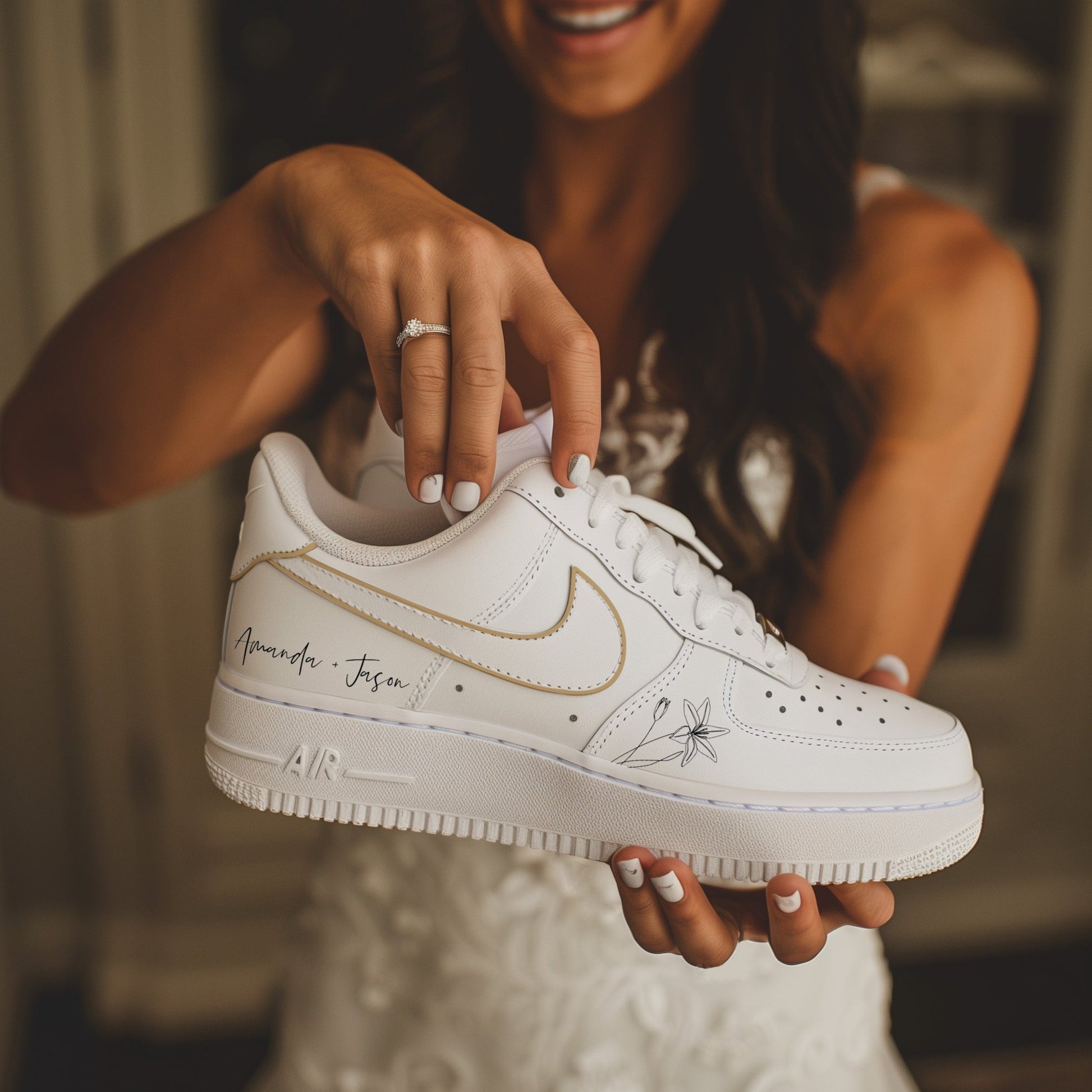 Custom gold wedding shoes with a white base and gold swoosh, bride holding sneaker in hand .designed for brides who want comfortable and stylish wedding shoes.