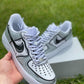 Close-up of custom Air Force 1 sneakers featuring a handpainted black and white comic-style outline for a unique visual effect.
