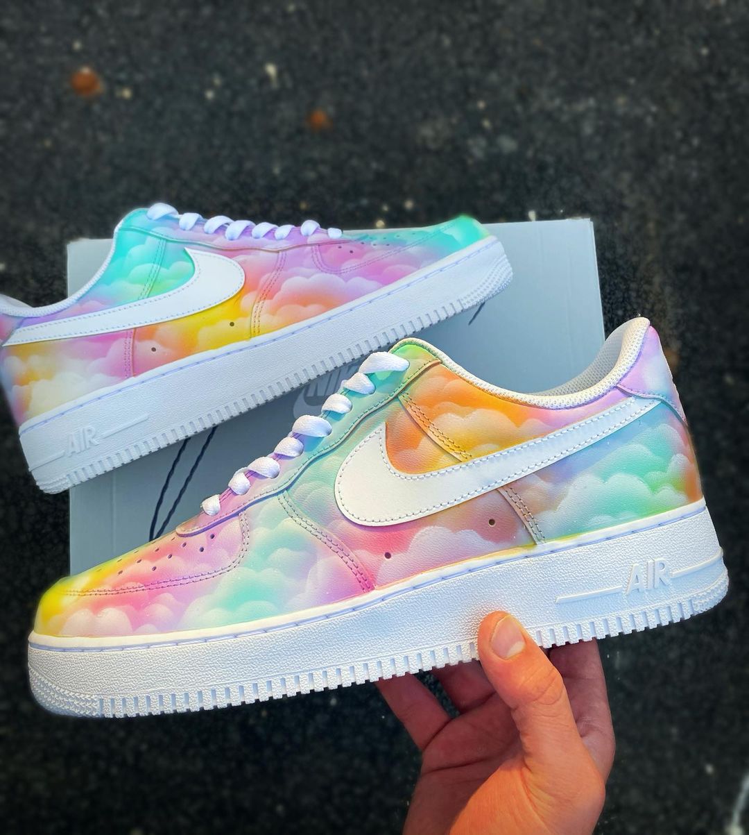 Side view of custom Nike Air Force 1 with a dreamy pastel cloud pattern and subtle rainbow gradient, white Nike swoosh.