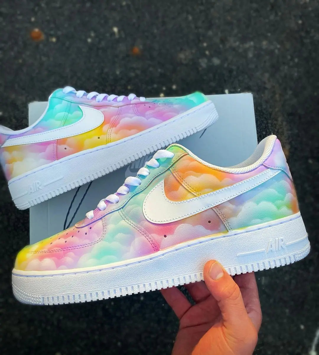 Side view of custom Nike Air Force 1 with a dreamy pastel cloud pattern and subtle rainbow gradient, white Nike swoosh.