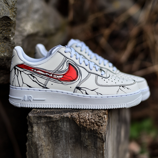 Unique custom sneakers with a medical-inspired fractured vein design and a striking red Swoosh accent.