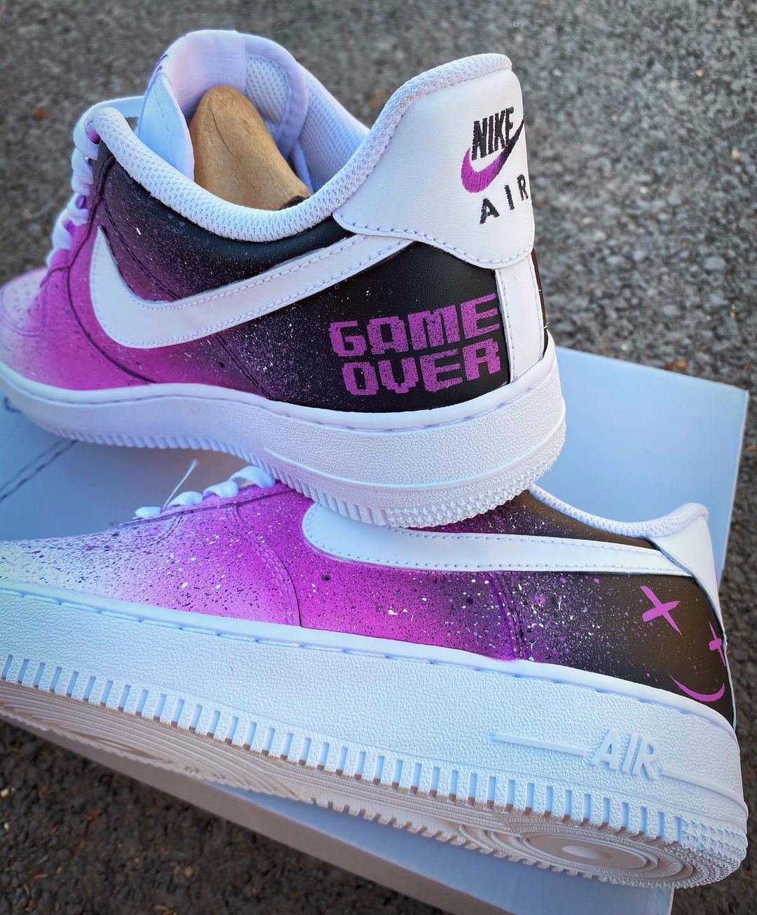 Custom Air Force 1 sneakers with a gradient purple and black galaxy design, featuring a white Nike swoosh and “Game Over” text on the heel.