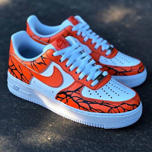 Unique custom sneakers with a striking volcanic eruption theme, combining deep black vein details with hot orange overlays