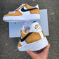 Side view of custom Nike Air Force 1 with a mustard yellow upper and black swoosh, creating a striking contrast.
