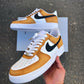 Custom Nike Air Force 1 sneakers with a mustard yellow and white colorway, featuring a bold black swoosh.