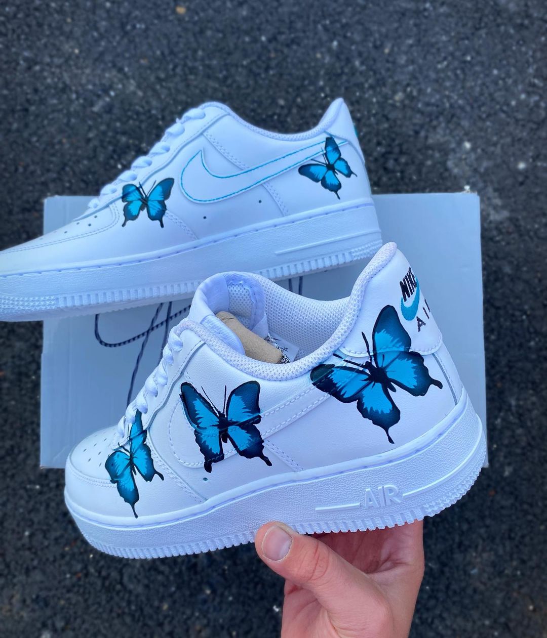 Custom Air Force 1 with realistic blue butterfly illustrations, emphasizing the contrast against the white sneaker.