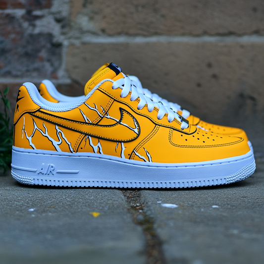 Close-up of custom Nike Air Force 1 sneakers featuring a vibrant yellow leather base with white and black lightning streaks.