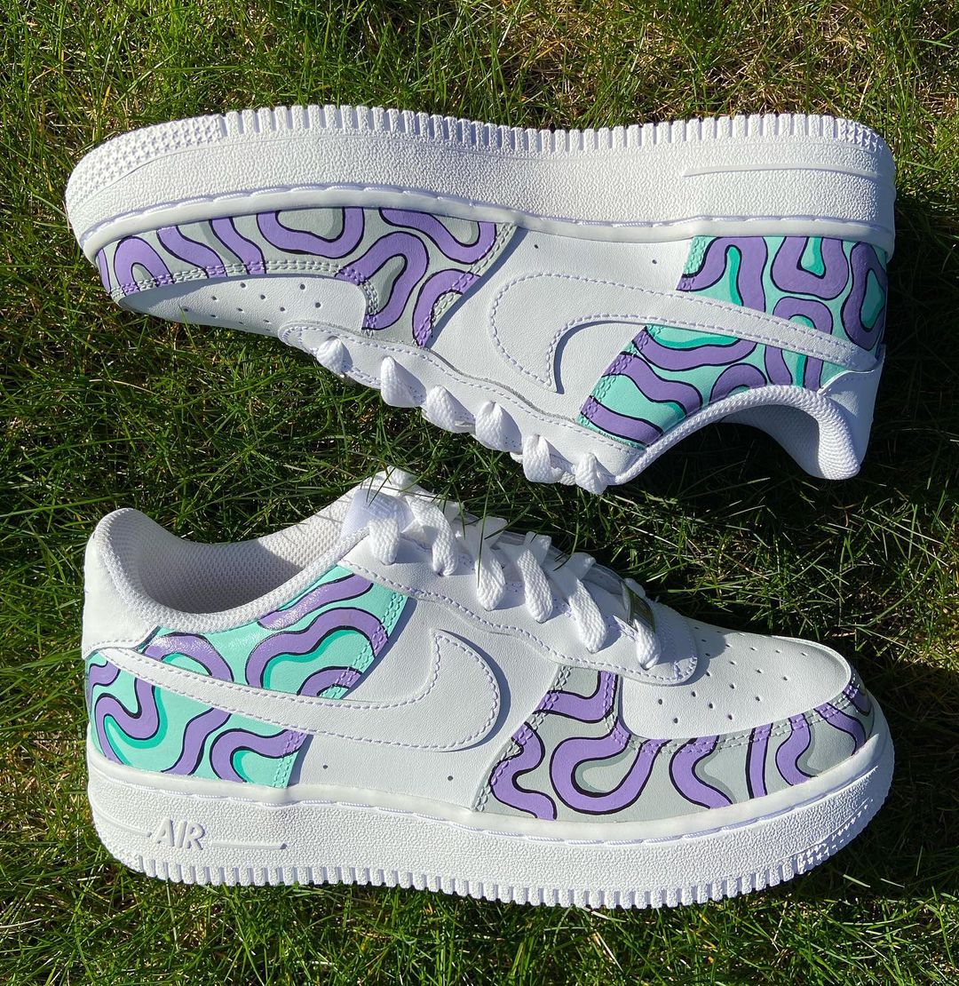 Custom Air Force 1s painted with a mint and lavender psychedelic swirl design, giving these classic Nikes a fresh, hand-painted look full of colorful movement.