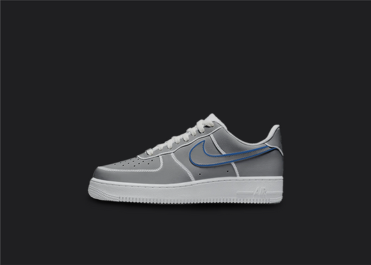 The image is featuring a Custom cartoon Air force 1 sneakers on a blank black background. The white nike sneaker has a black and blue swoosh design on the entire air force sneaker. 