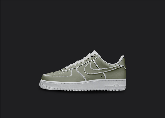 The image is featuring a Custom cartoon Air force 1 sneakers on a blank black background. The white nike sneaker has a pastel green cartoon design on the entire air force sneaker. 