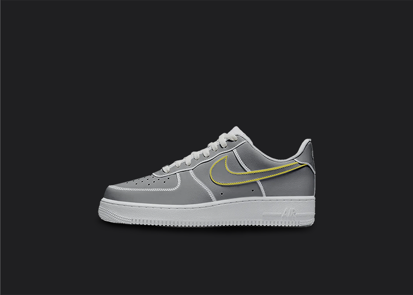 The image is featuring a Custom cartoon Air force 1 sneakers on a blank black background. The white nike sneaker has a black and yellow swoosh design on the entire air force sneaker. 