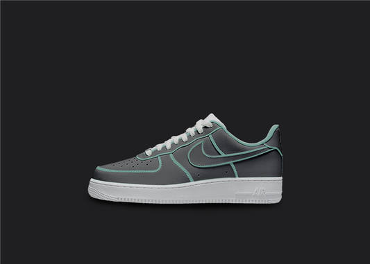 The image is featuring a Custom cartoon Air force 1 sneakers on a blank black background. The white nike sneaker has a black and blue design on the entire air force sneaker. 