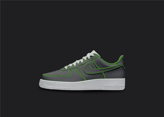 The image is featuring a Custom cartoon Air force 1 sneakers on a blank black background. The white nike sneaker has a black and green design on the entire air force sneaker. 