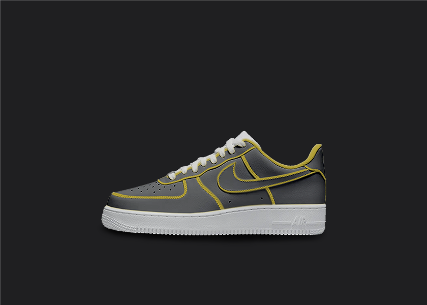 The image is featuring a Custom cartoon Air force 1 sneakers on a blank black background. The white nike sneaker has a black and yellow design on the entire air force sneaker. 