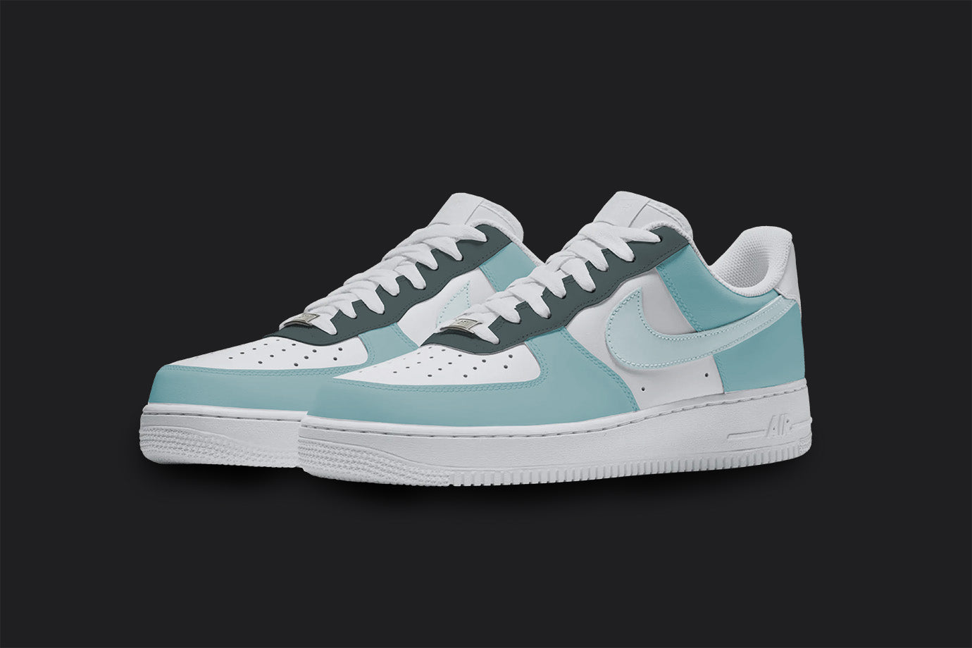 The image is of a Custom Nike Air force 1 sneaker pair on a blank black background. The custom sneakers are painted in lighter blue and gray colors. 
