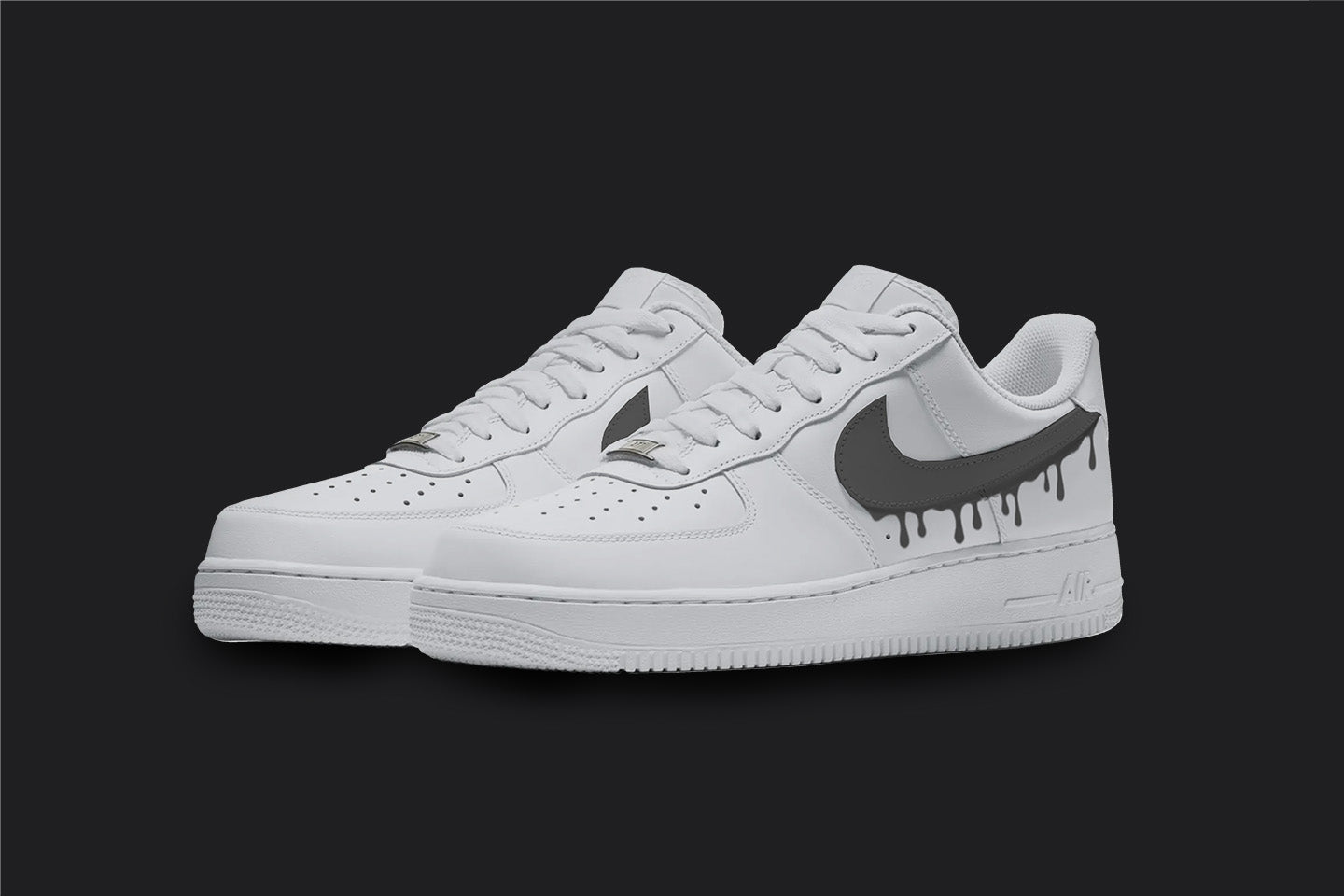 The image is of a Custom Nike Air force 1 sneaker pair on a blank black background. The white custom sneakers have a black dripping design. 