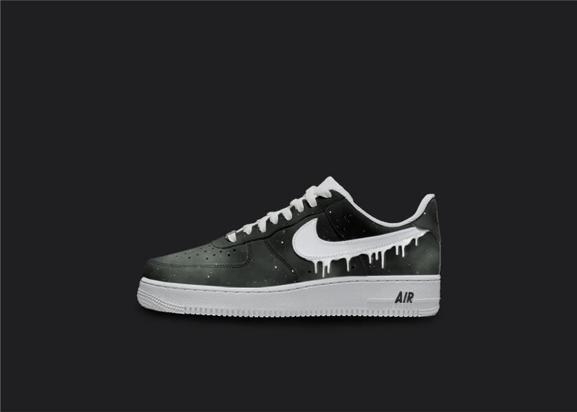 Custom Nike air force 1s are displayed on a dark blank background. The sneakers feature a  custom black galaxy fade design with white star splatters all over the sneakers. The Nike logo is painted in white with a dripping design