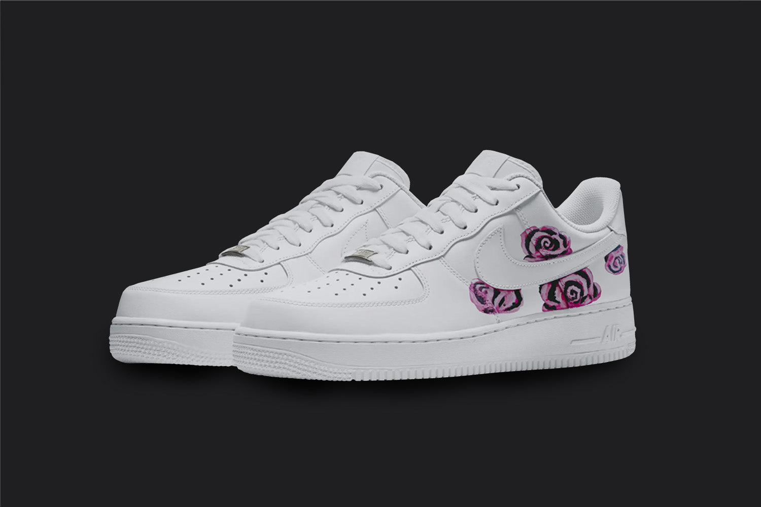 The image is of a Custom Nike Air force 1 sneaker pair on a blank black background. The white custom sneakers have 4 pink roses design on the sides. 