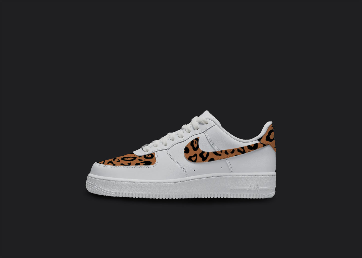 The image is of a Custom Nike Air force 1 sneaker on a blank black background. The white custom sneaker has a Cheetah print in the front and on the nike logo. 
