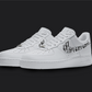 The image is of a Custom Nike Air force 1 sneaker pair on a blank black background. The custom sneaker pair has a dior pattern design on the nike logo.