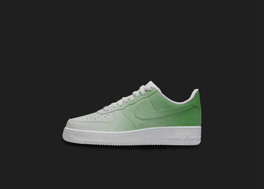The image is of a Custom Nike Air force 1 sneaker on a blank black background. The white custom sneaker has all over Green fade design.