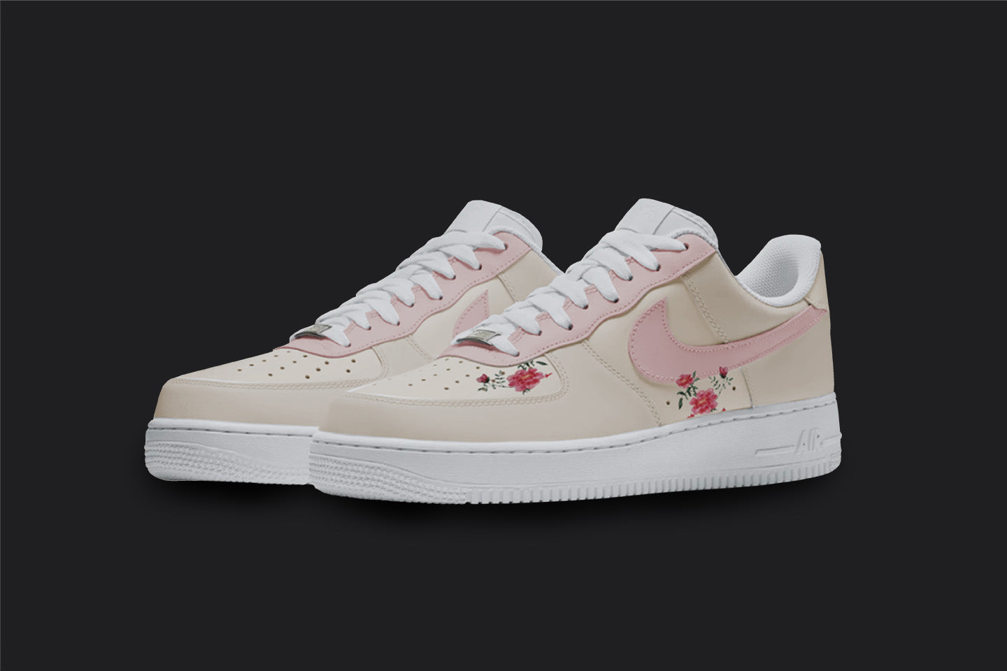 The image is of a Custom Nike Air force 1 sneaker pair on a blank black background. The white custom sneakers have a Pink nike logo with floral illustrations on the sides.