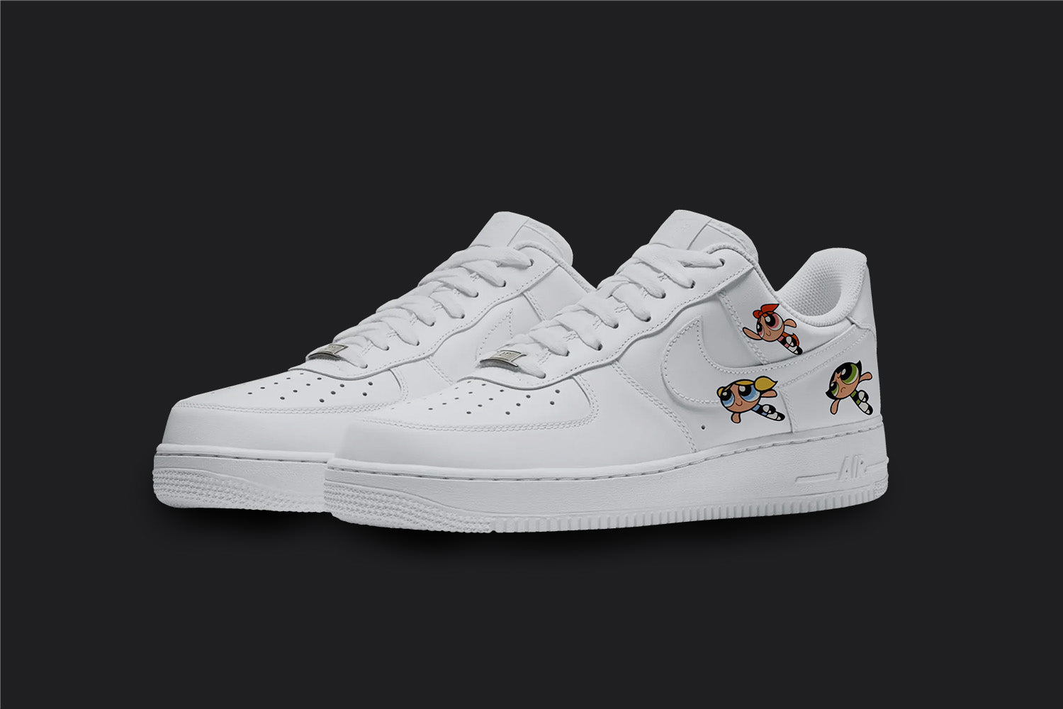 The image is of a Custom Nike Air force 1 sneaker pair on a blank black background. The white custom sneakers have 3 Power Puff Girls on the side of the sneakers.