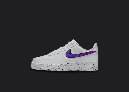 The image is of a Custom Nike Air force 1 sneaker on a blank black background. The white custom nike sneaker has a purple splatter covering the sole and the nike logo.  