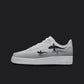 The image is of a Custom Nike Air force 1 sneaker on a blank black background. The white custom nike sneaker has a gray fade and 2 sharks swimming on the side.  