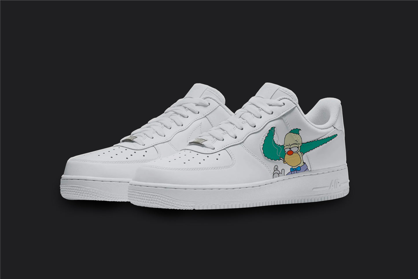 The image is of a Custom Nike Air force 1 sneaker pair on a blank black background. The white custom sneakers have a krusty the clown from simpsons design on the side of the shoes.