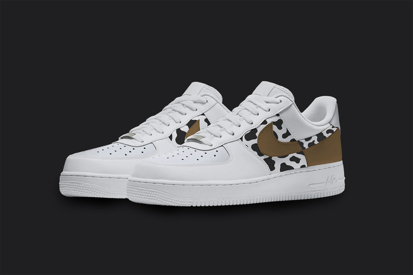 The image is of a Custom Nike Air force 1 sneaker on a blank black background. The custom sneaker pair is painted in a black and brown cow print. 