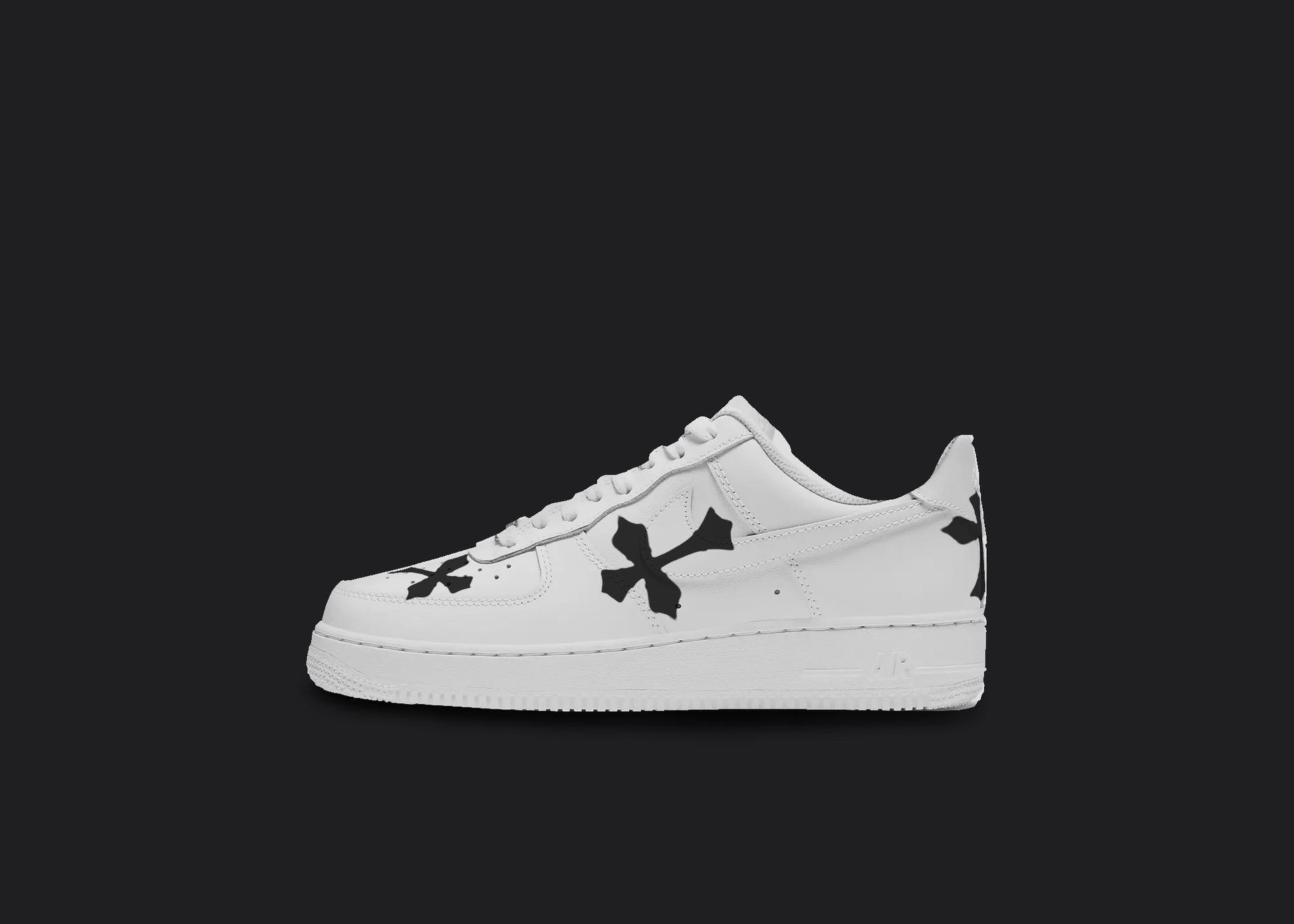 The image is featuring a Custom Nike Air force 1 sneakers on a blank black background. All over the white nike sneakers are 3 visible black crosses