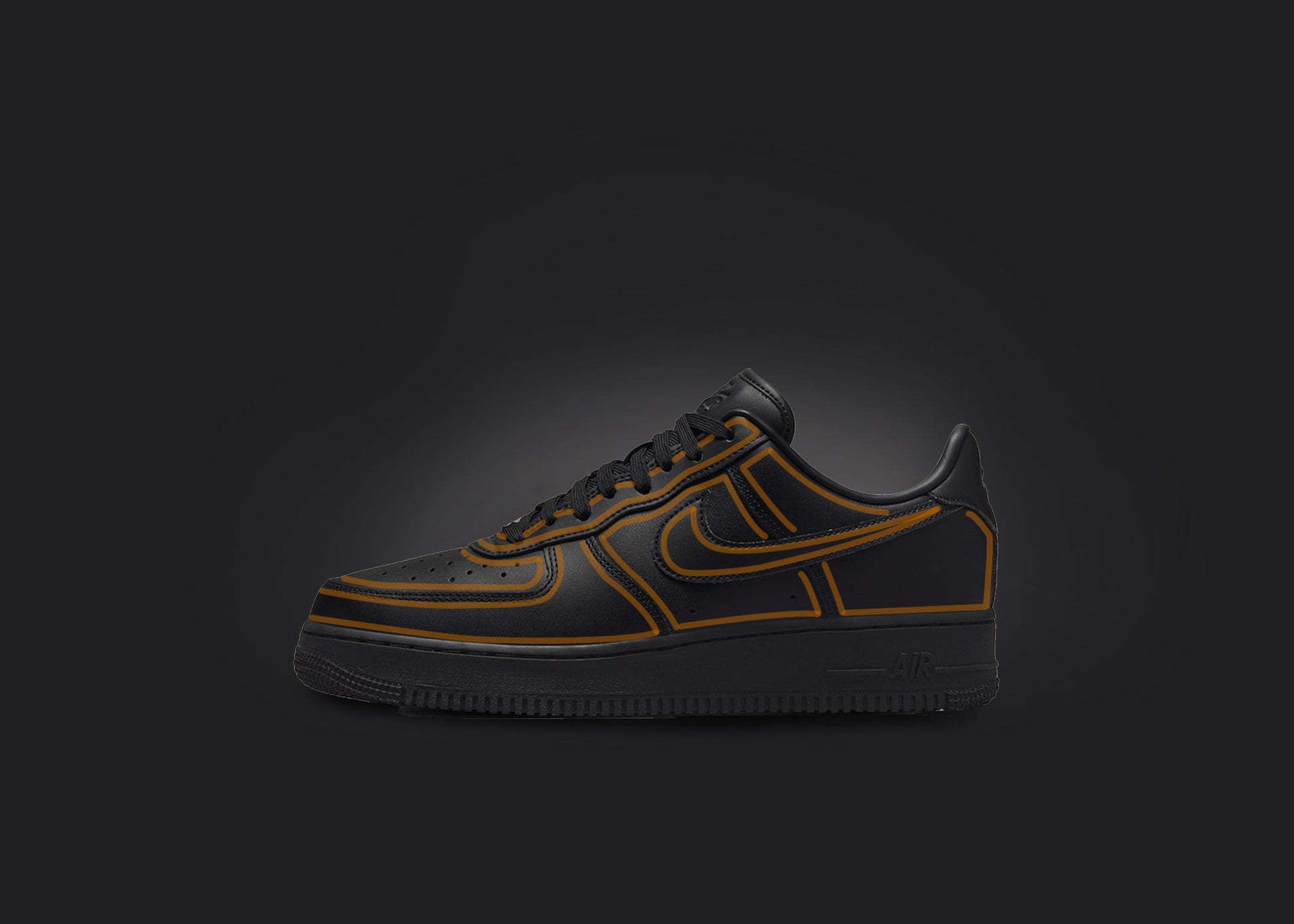 The image is featuring a custom black Air force 1 sneaker on a blank black background. The black nike sneaker has a orange cartoon outline design all over the sneaker. 