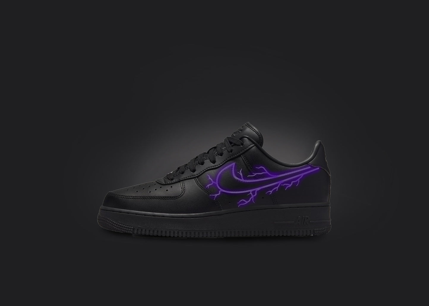 The image is featuring a custom black Air force 1 sneaker on a blank black background. The black nike sneaker has a purple lightning design on the nike logo. 