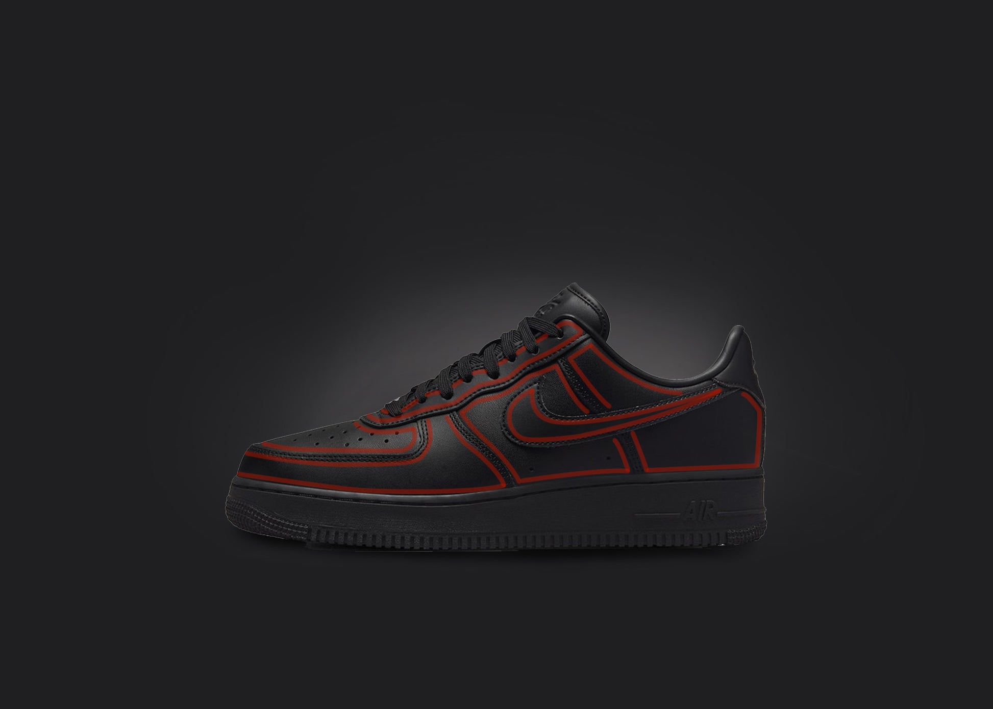 The image is featuring a custom black Air force 1 sneaker on a blank black background. The black nike sneaker has a red cartoon outline design all over the sneaker. 