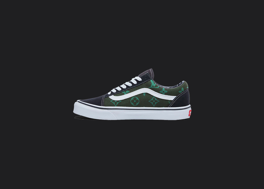 The image is featuring a custom hand painted vans shoes on a blank black background. The vans old skools sneaker has a green custom vans louis vuitton design on the side of shoes. 