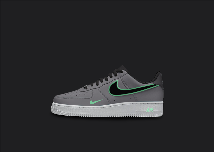 Custom Nike AF1 sneakers in shades of gray and lime. The gray base of the shoe features lime accents on the Nike logo, base and sole. The hand-painted design adds a unique touch to these one-of-a-kind sneakers. 